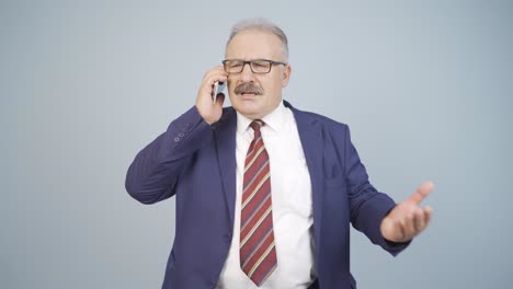 Angry-talking-businessman-on-the-phone.